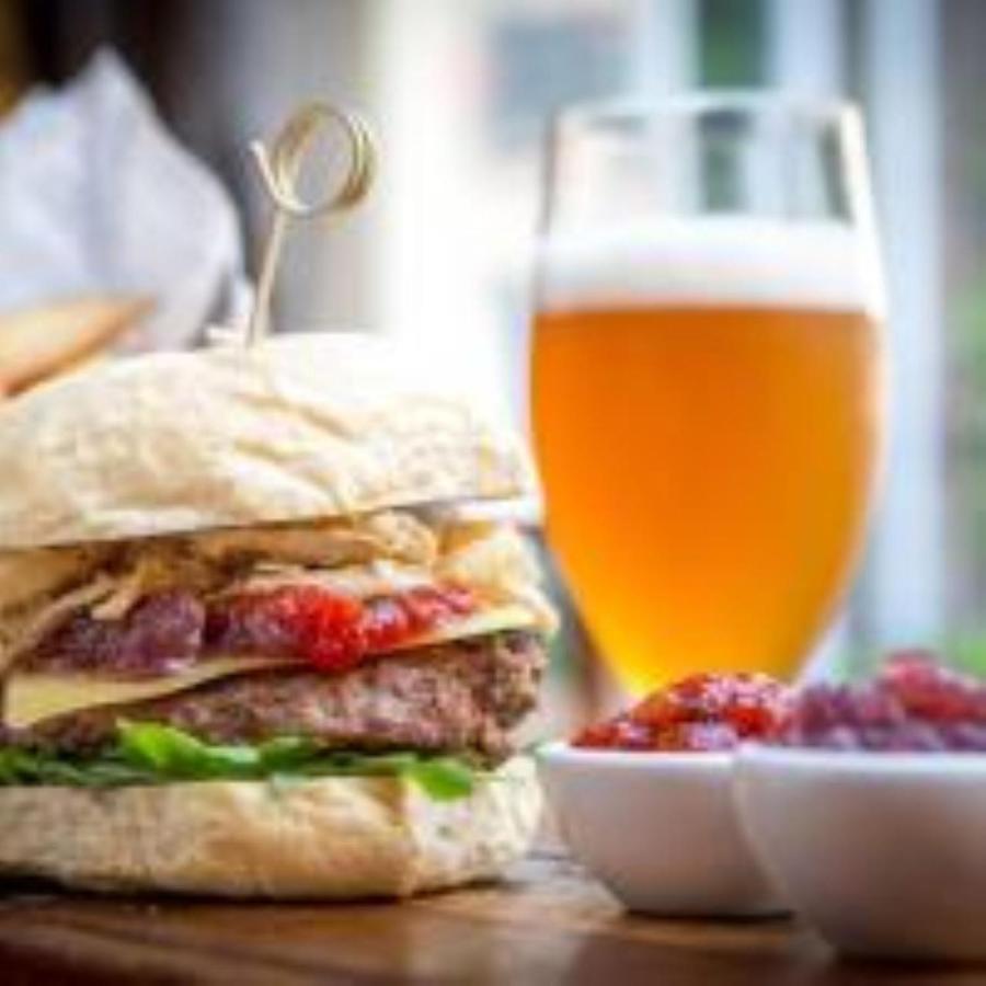 Maldron Hotel Glasgow City Exterior photo A photo of a vegan burger with a glass of beer